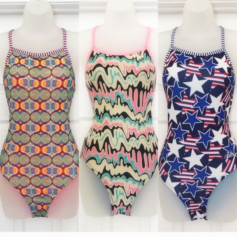 Dolphin lot three competition suits 32